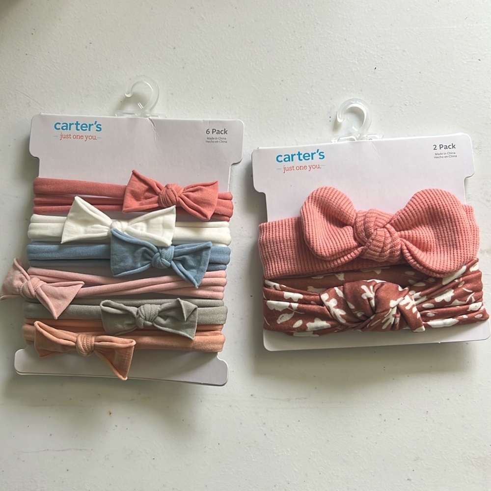 Two packs of Carter’s bows/headbands 8 total